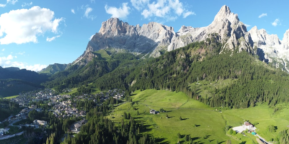 a valley between mountains with houses