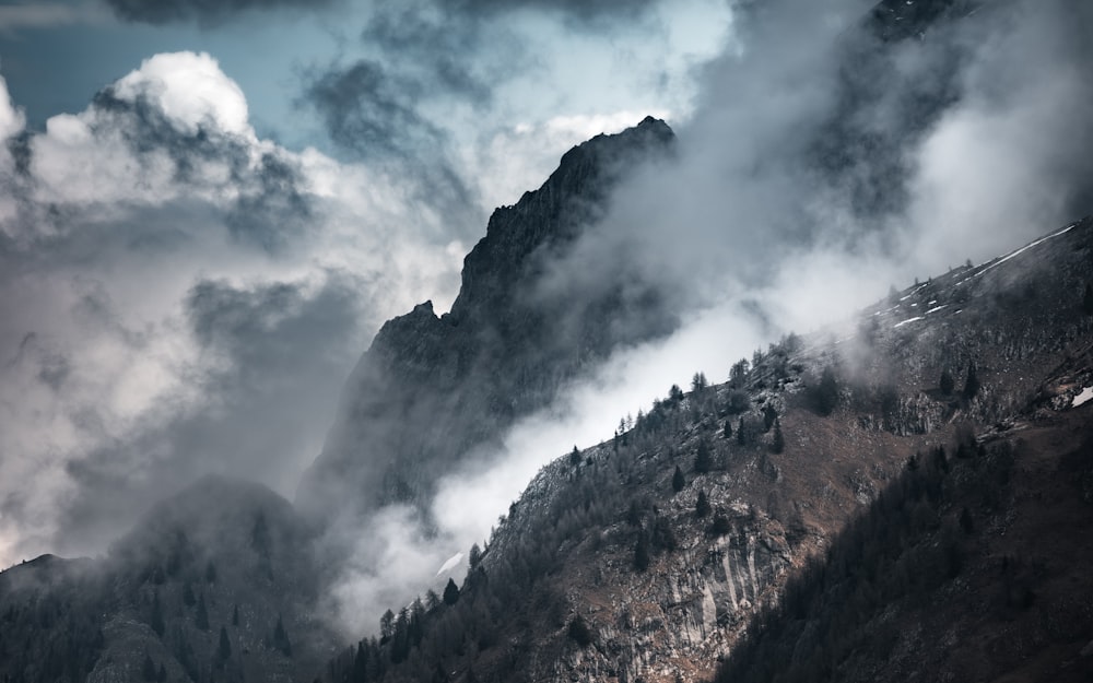 a mountain with clouds