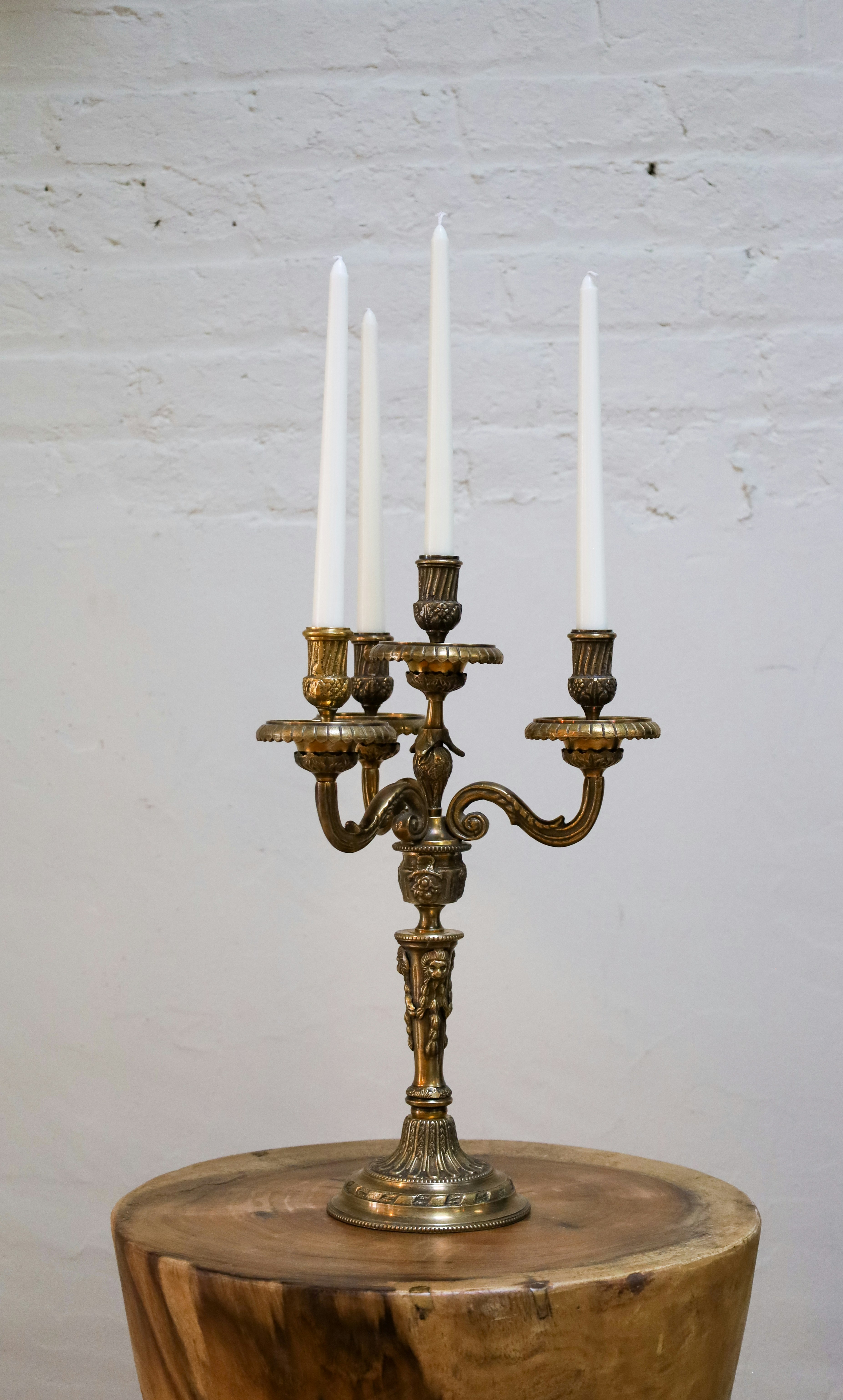 A gold and silver candle holder photo Free Grey Image on Unsplash