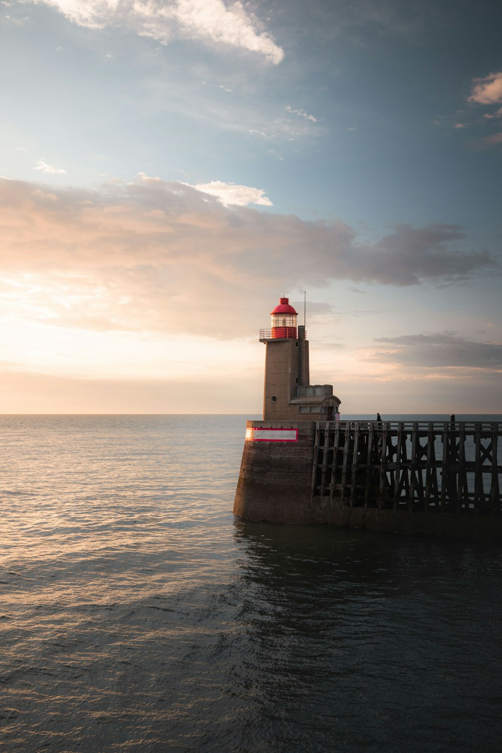 a lighthouse on a pier