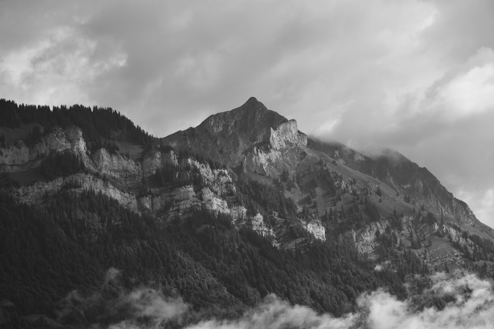 a mountain with clouds around it