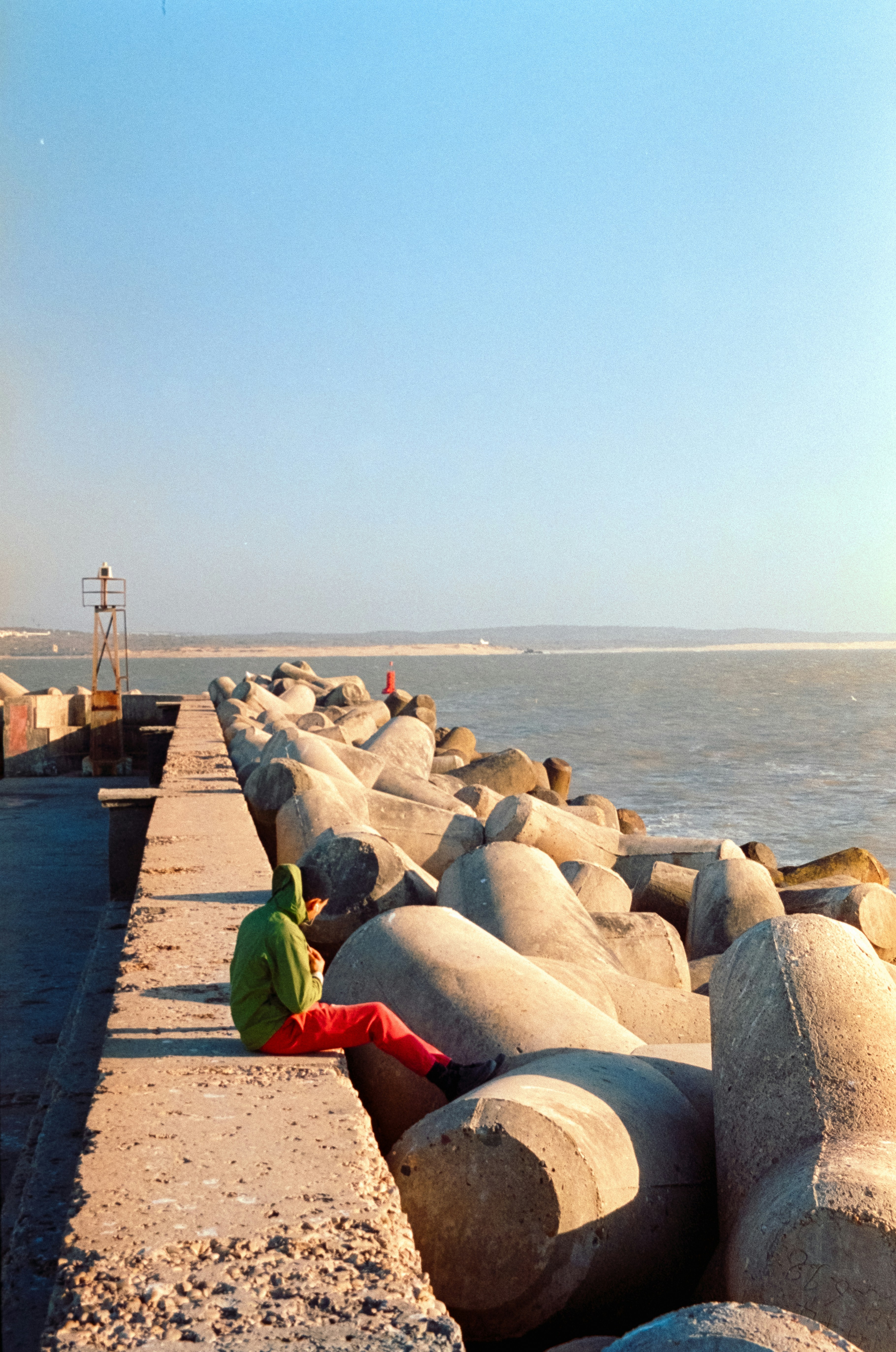 a person sitting on a rock