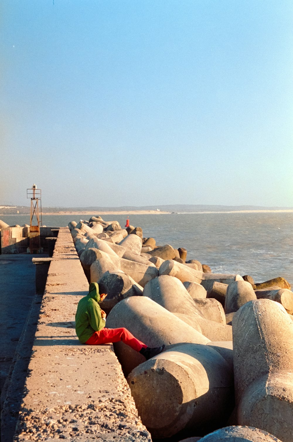 a person sitting on a rock