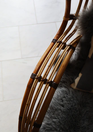 Handcrafted wooden furniture components arranged on a soft cream background.