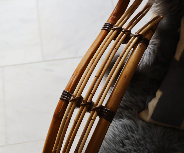Handcrafted wooden furniture components arranged on a soft cream background.