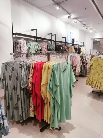a store with a variety of clothes on the racks