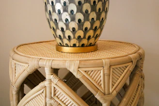 A vibrant 3D printed decorative vase with intricate geometric patterns on a wooden table.
