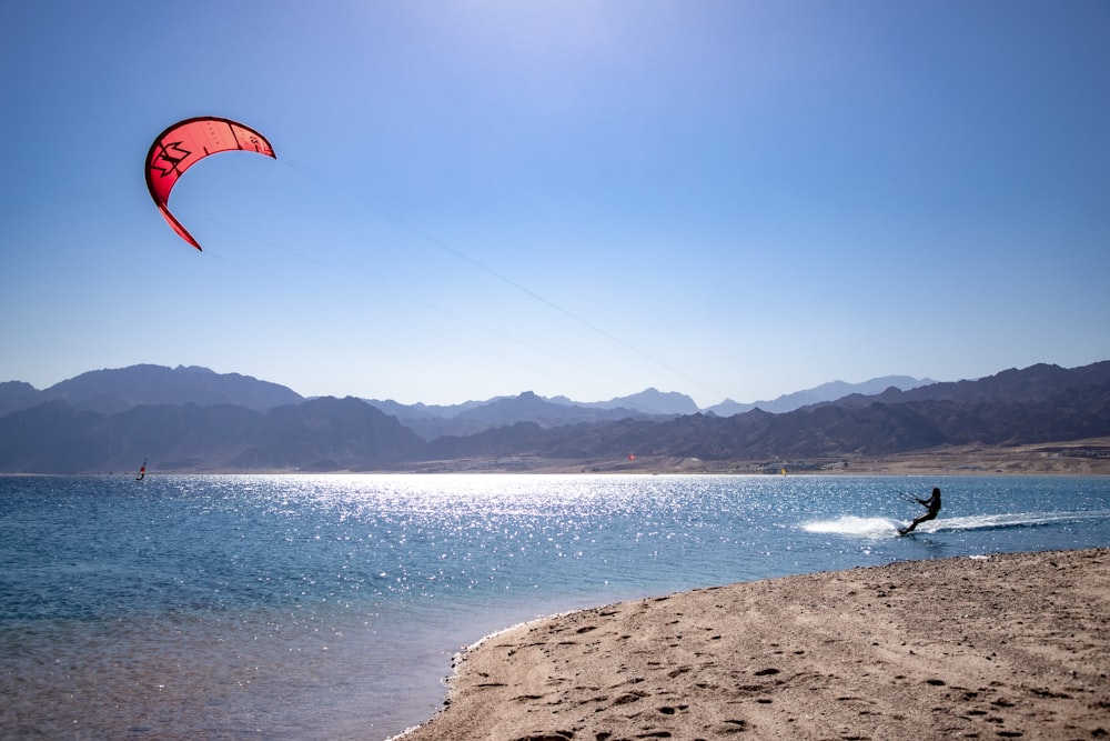 a person kite surfing on the sea