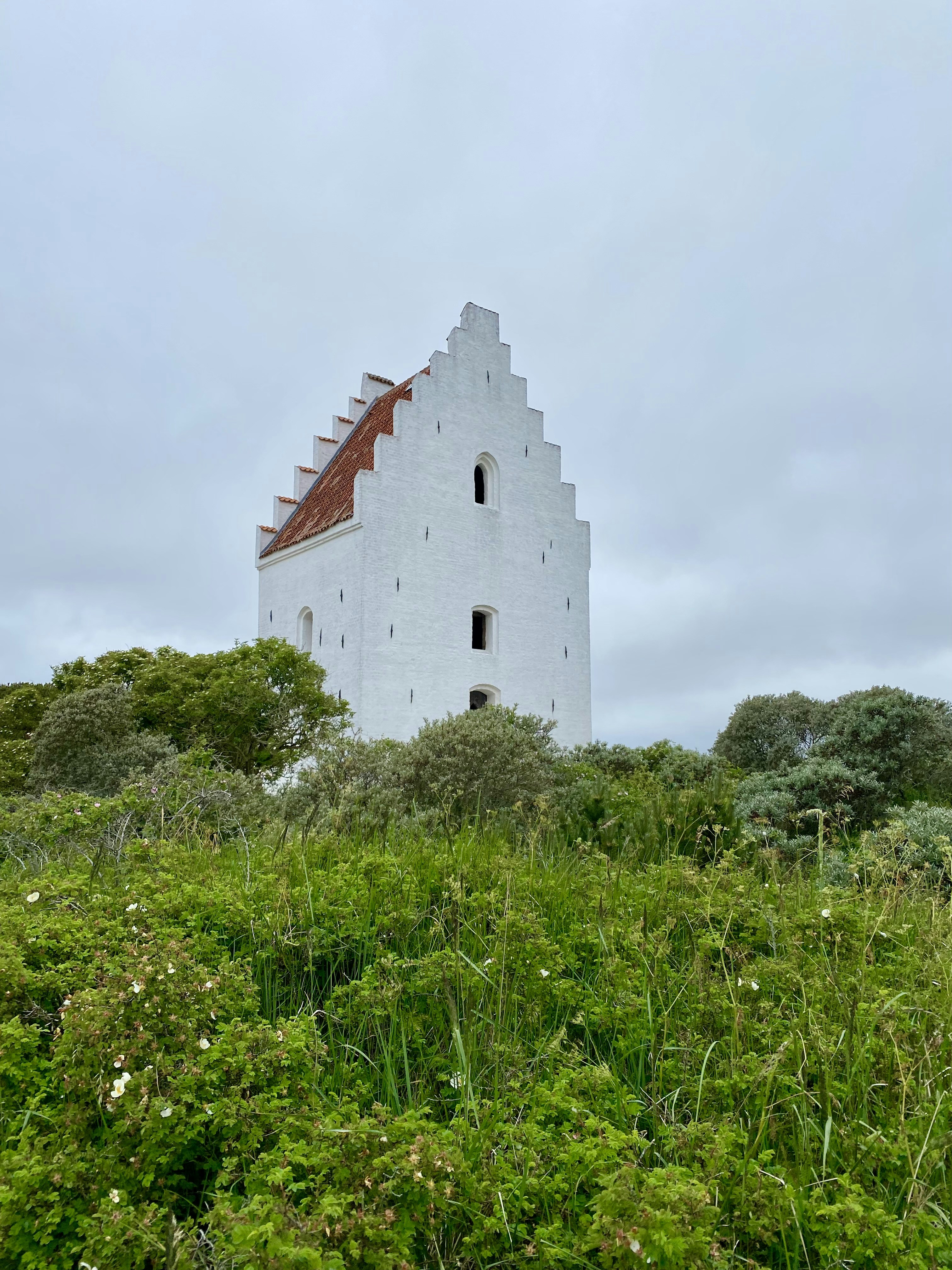 a white building with a tower
