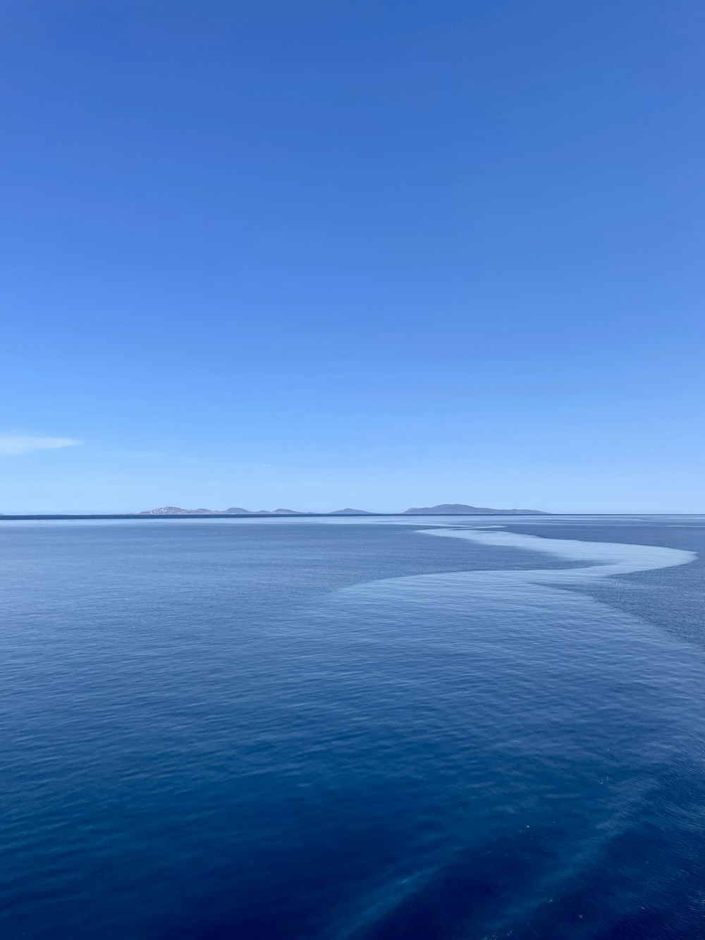 a body of water with land in the distance