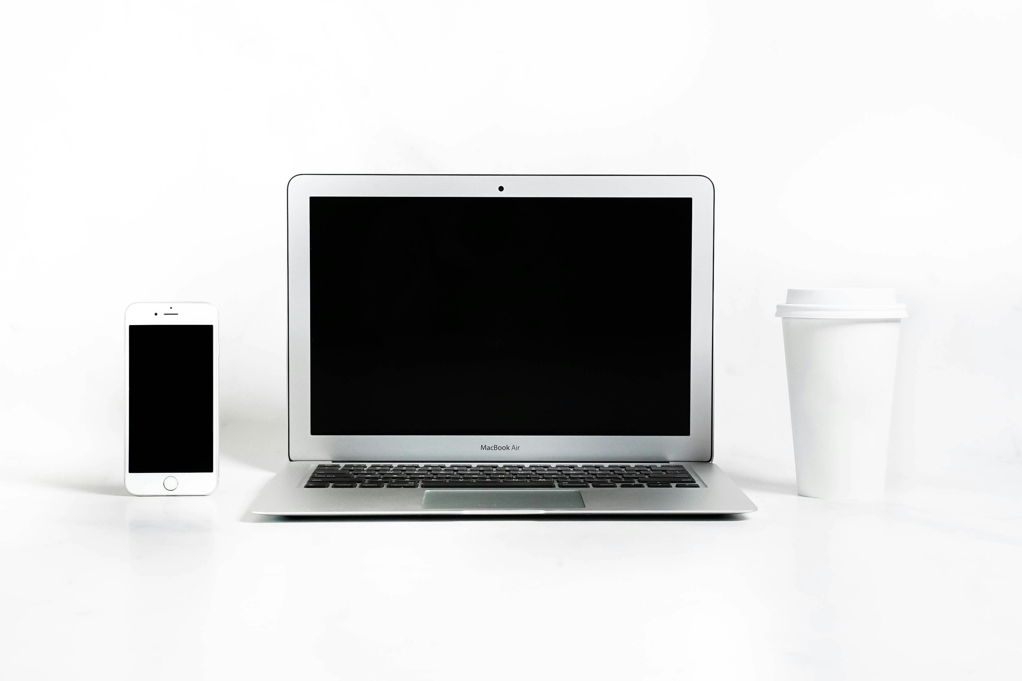 a laptop and a coffee cup