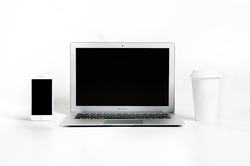 a laptop and a coffee cup