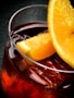 a glass of liquid with lemons
