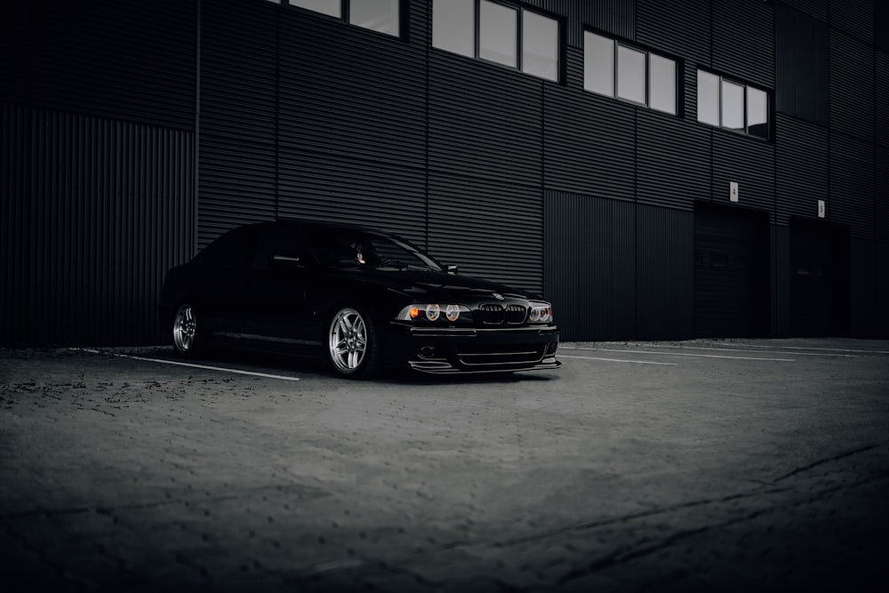 a black car parked in a garage