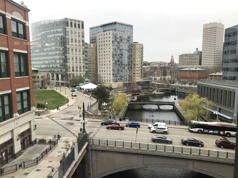 a city with a river and cars