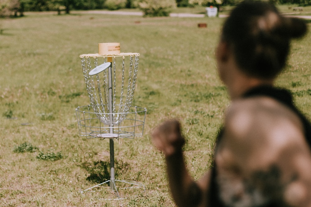 a person is looking at a bird feeder