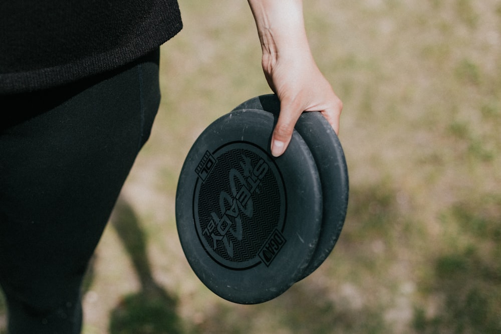 a person holding a frisbee