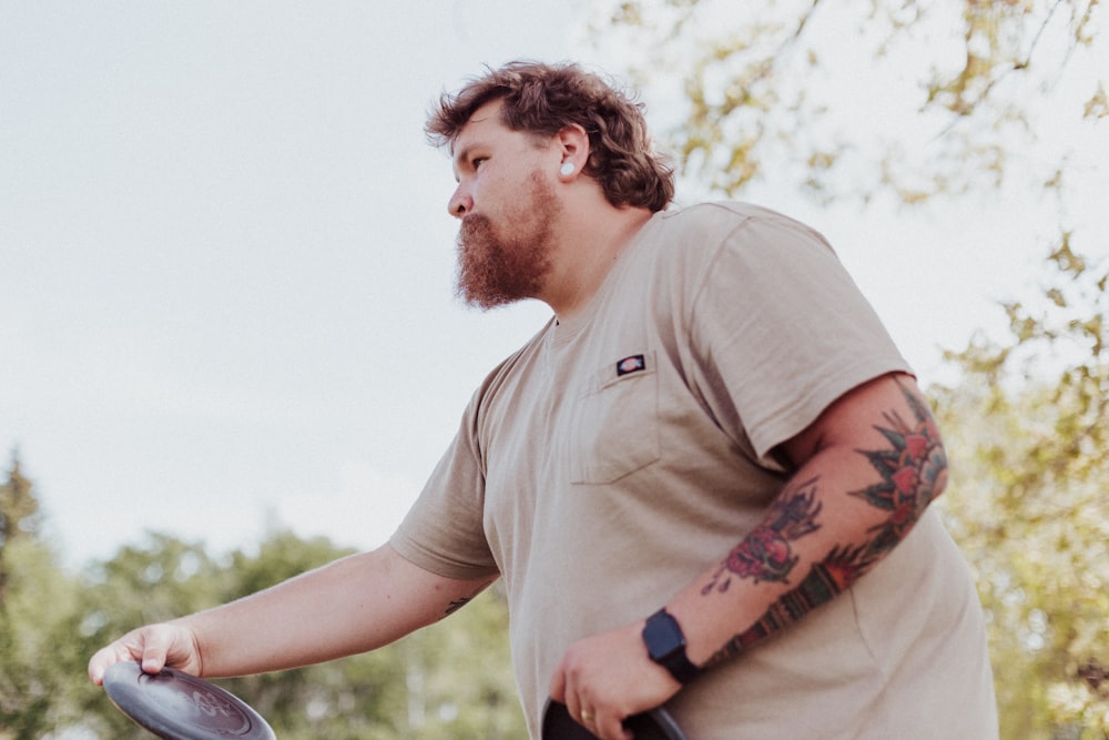 a man holding a frisbee