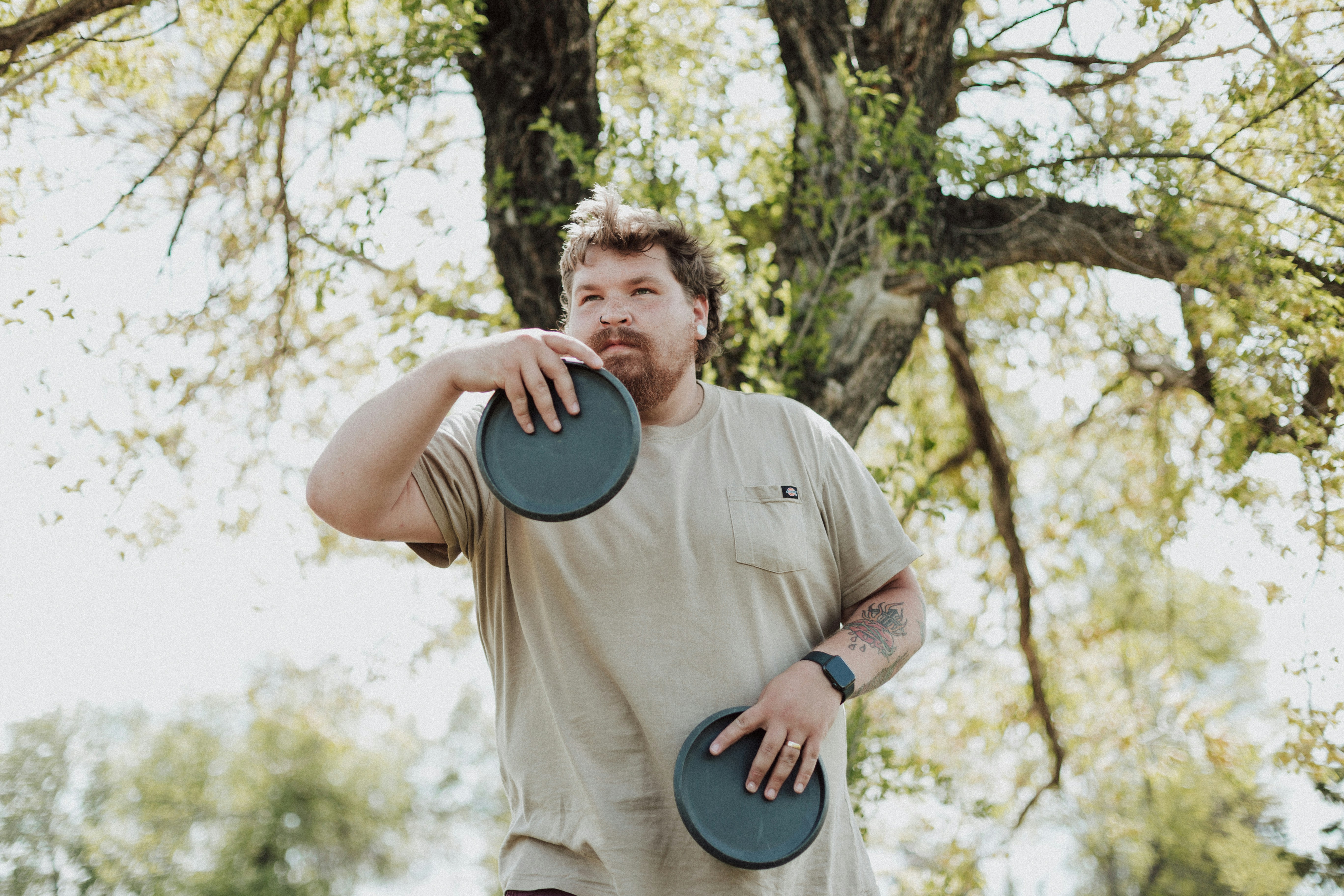 a man holding a frisbee