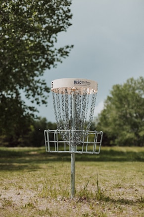 a disc golf hole in a field