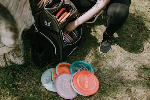 a person with a bag and buckets of paint