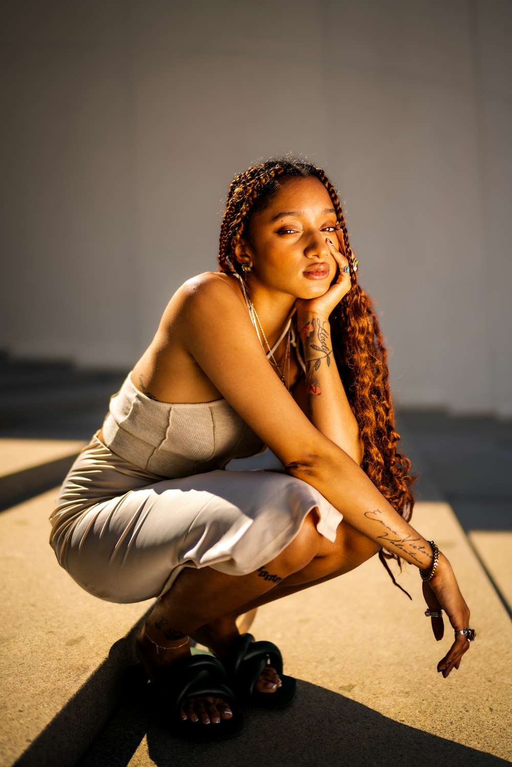 a woman sitting on the ground