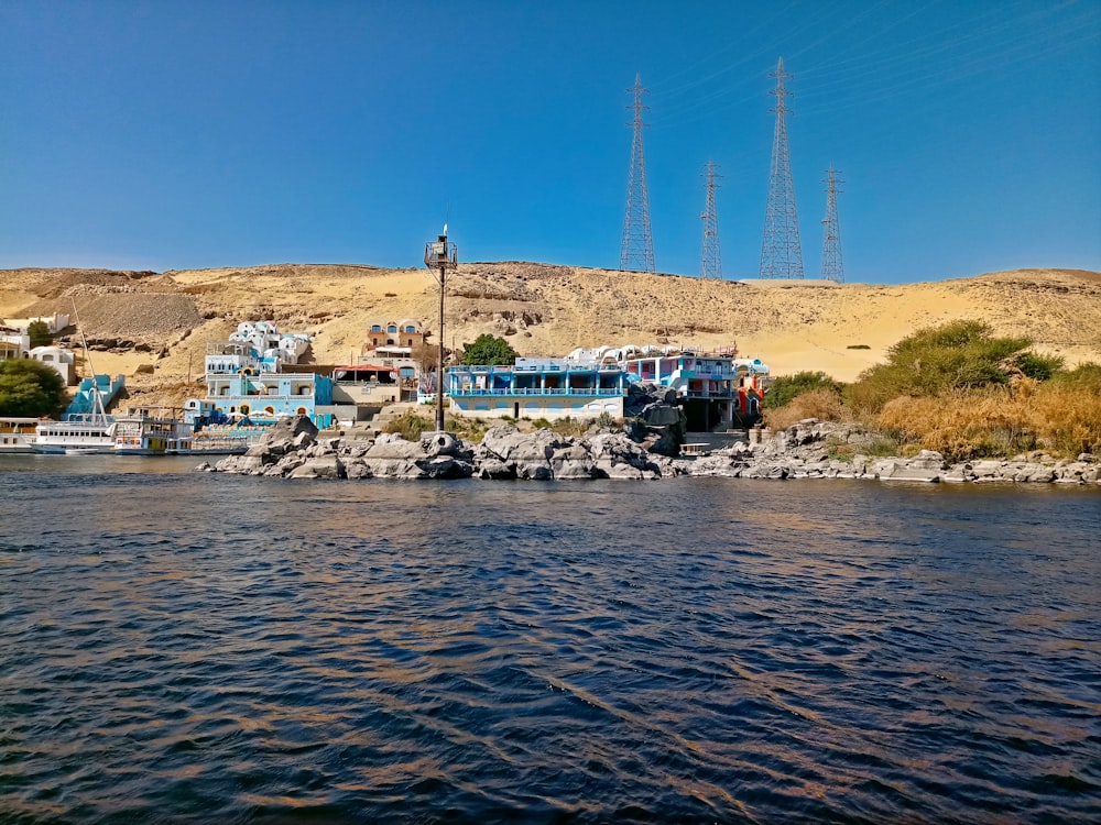 a group of boats sit on a rocky shore