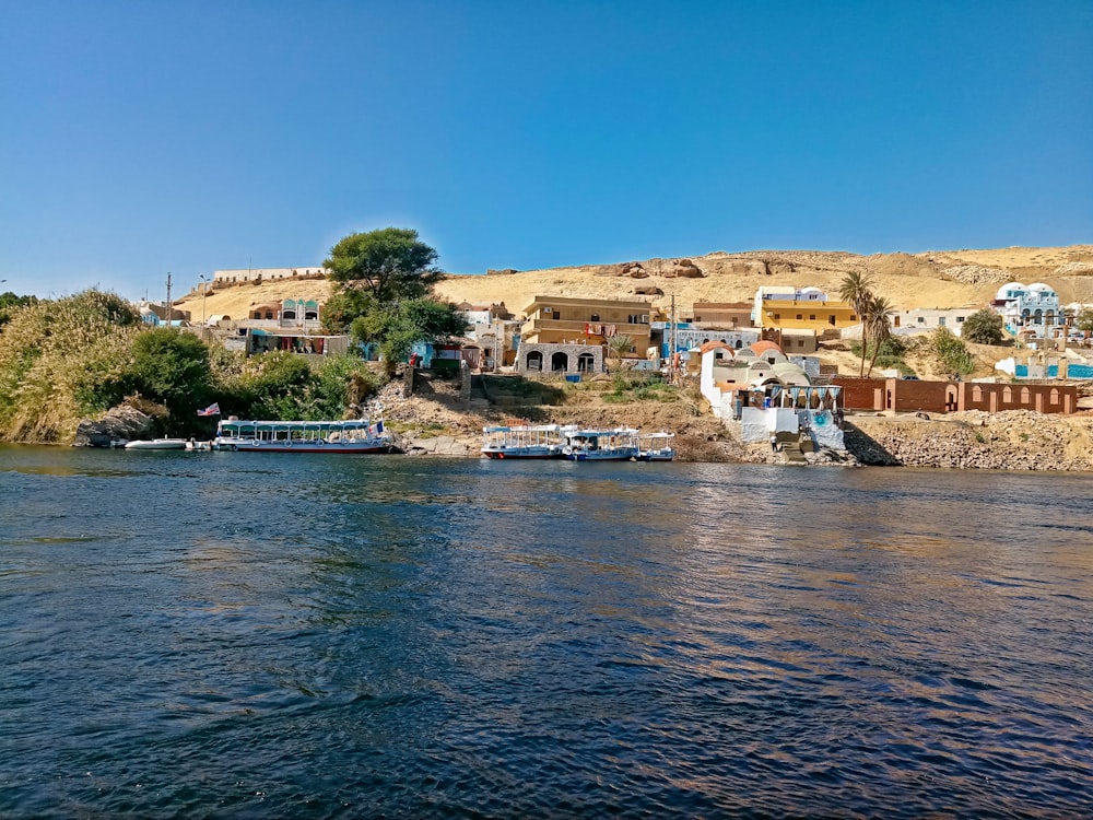 a body of water with boats in it and buildings in the back