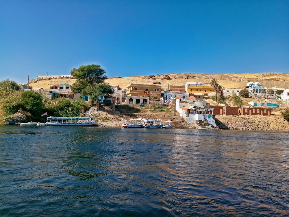 a body of water with boats and buildings along it