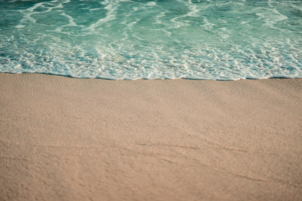 a sandy beach with waves