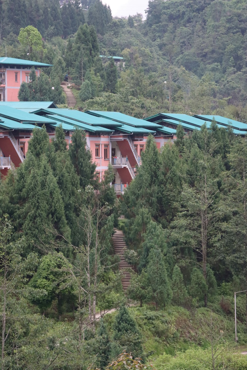 a group of buildings in a wooded area