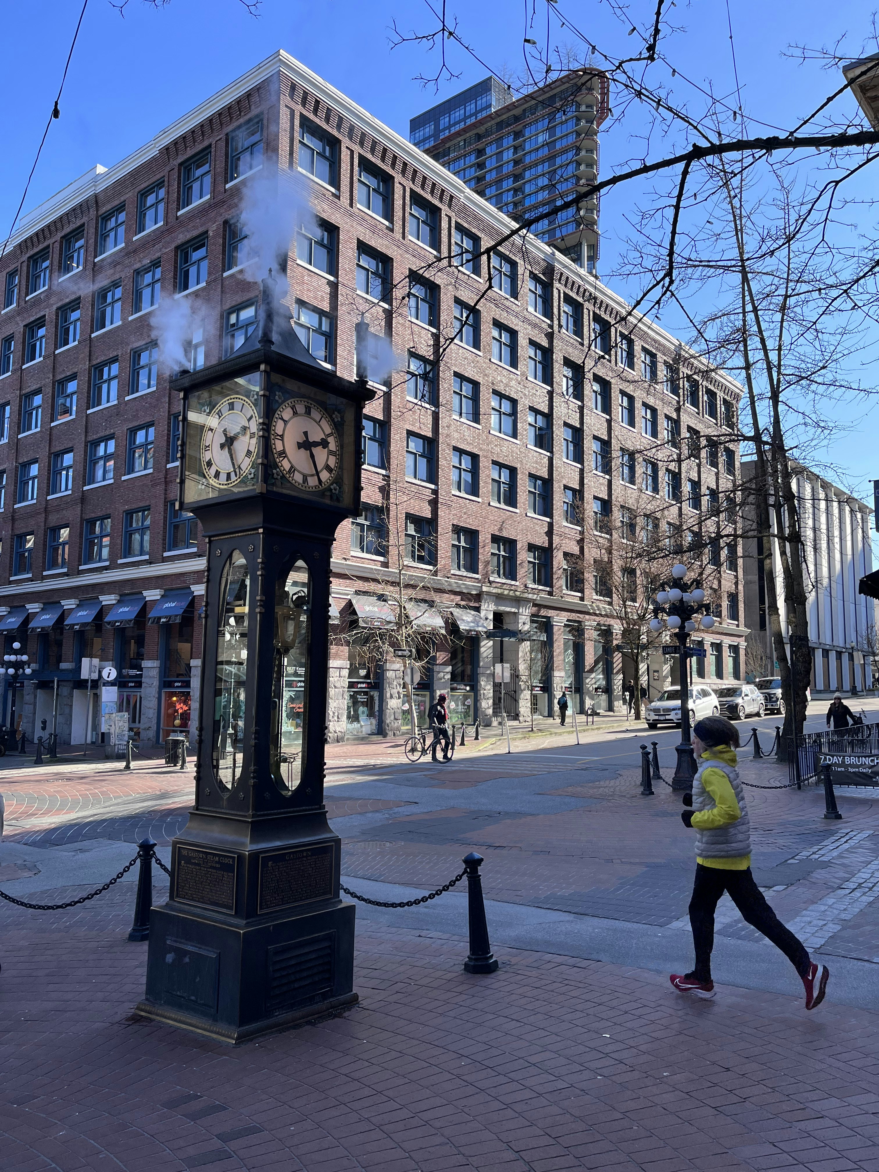 a clock on a sidewalk