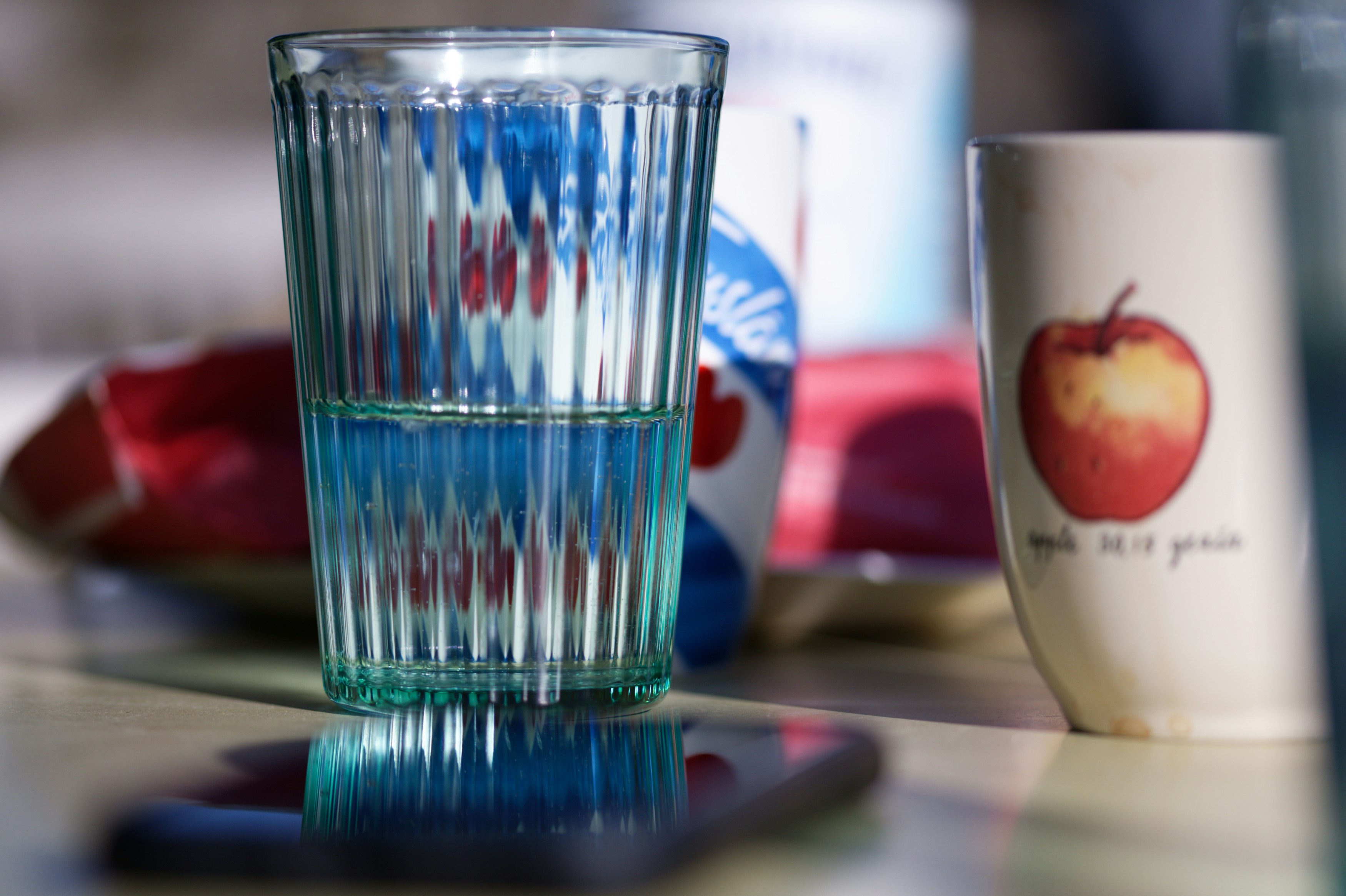 Healthy hydration setup with a water bottle and fresh fruit slices - best lunch after workout