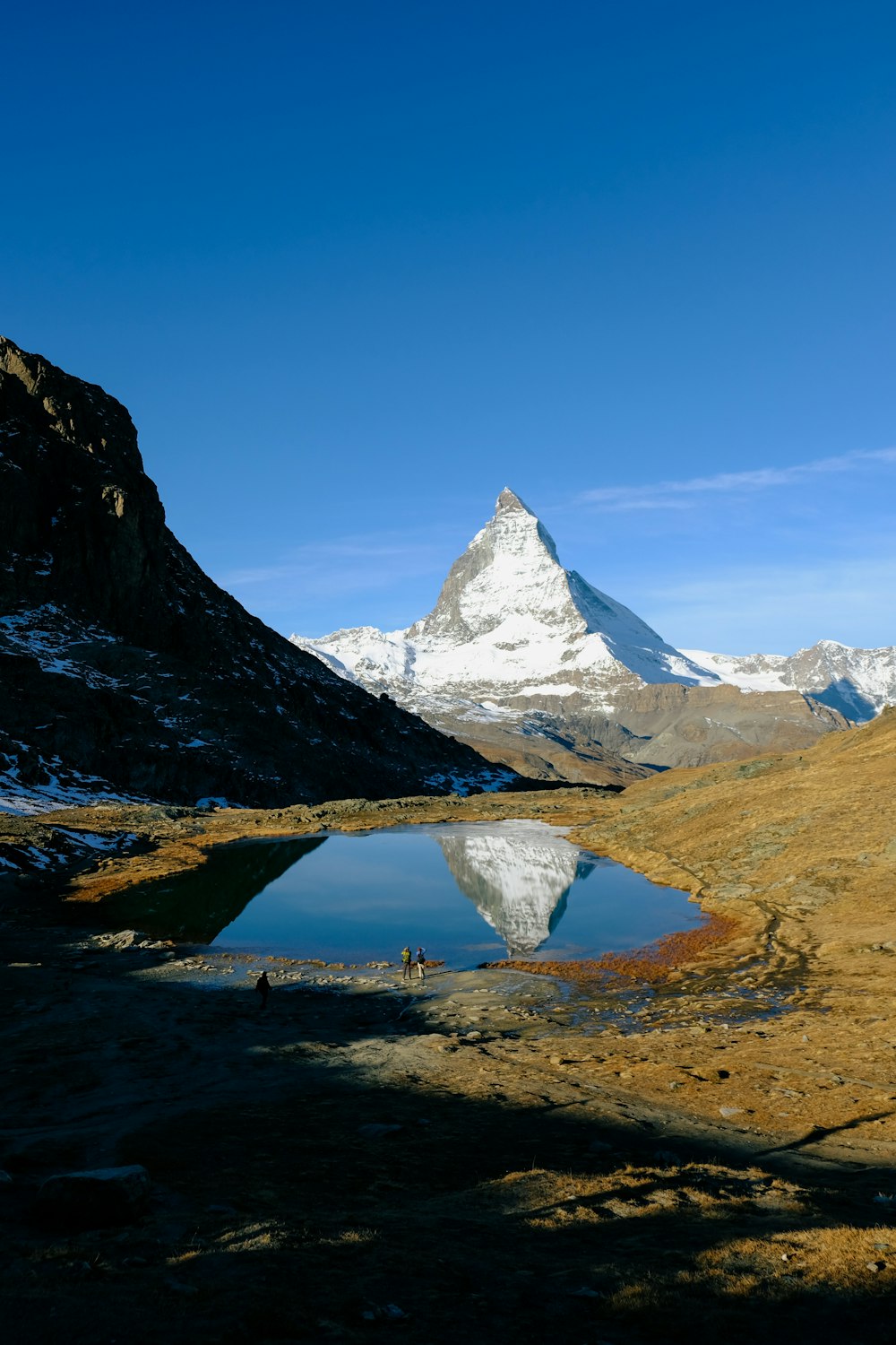 a lake in a snowy mountainous region