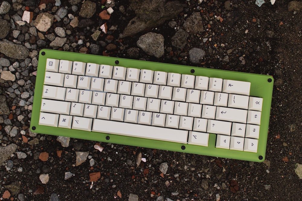 a keyboard on a rock