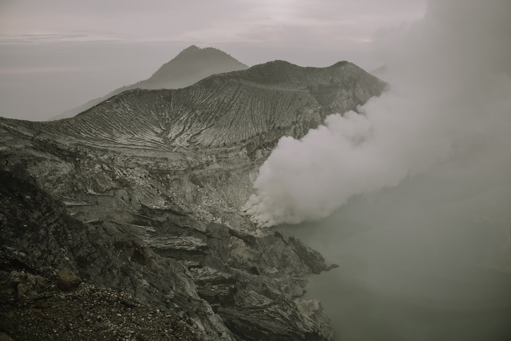 a mountain with clouds around it