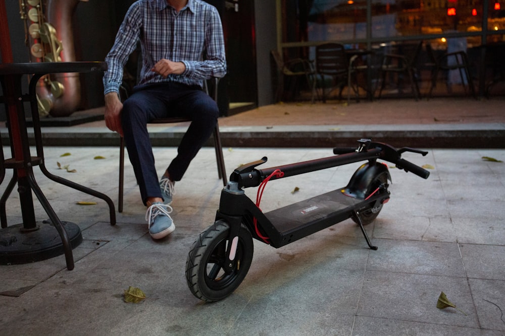 a man sitting on a scooter