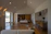 A sleek, modern living room bathed in natural light showcasing a luxury property.