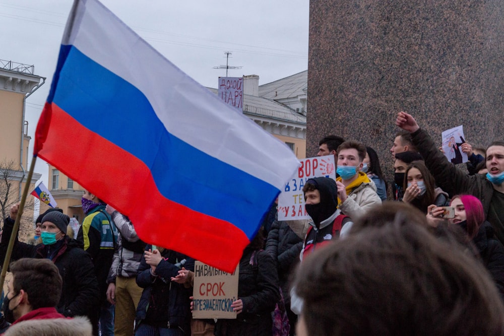 a group of people holding flags