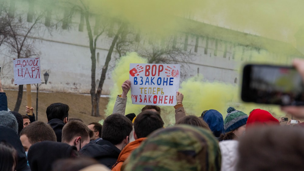 a group of people holding signs