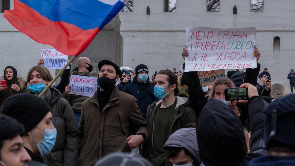 a group of people holding signs