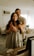 A beautifully framed large-format photo of a couple in a cozy living room.