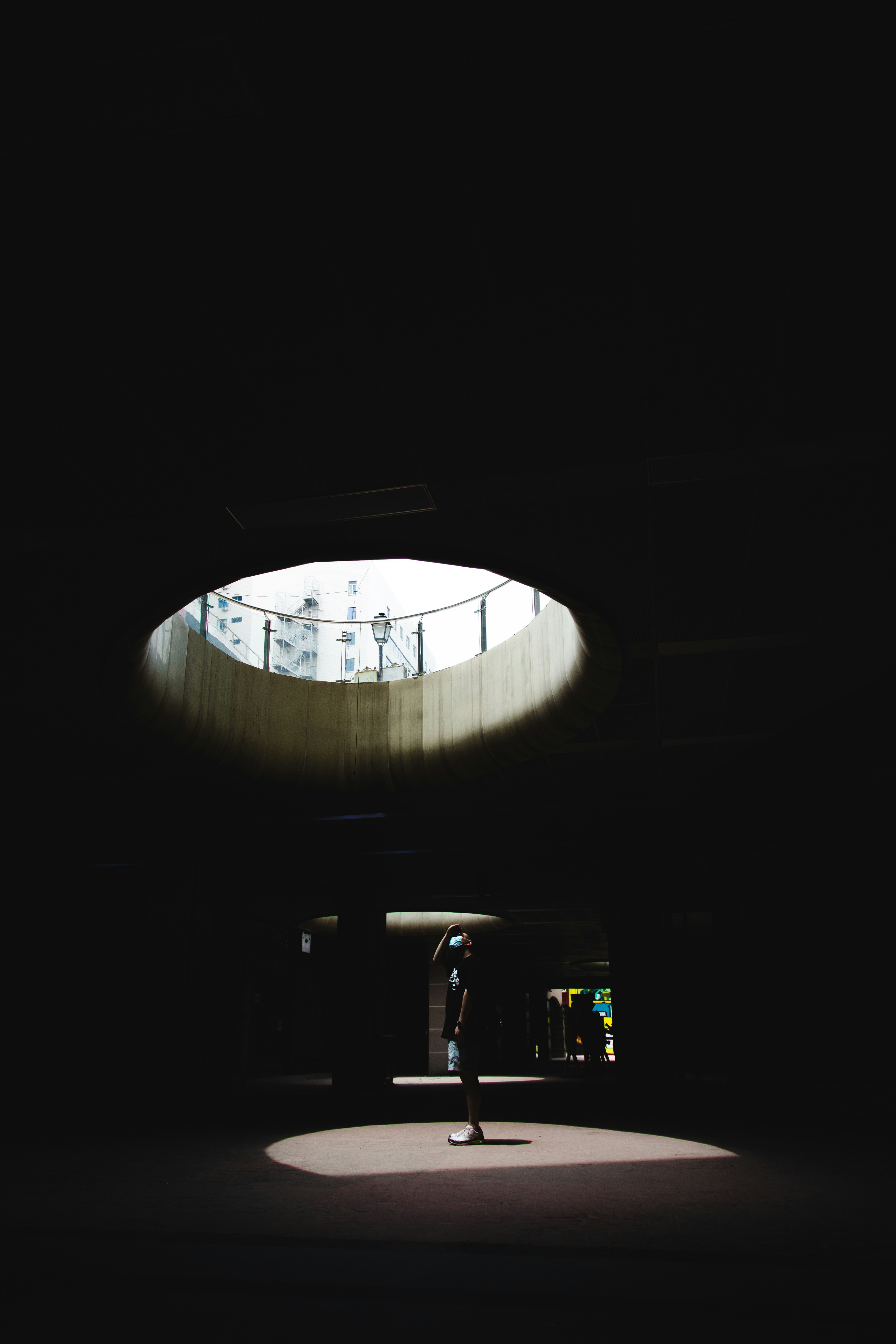 woman wearing yellow long-sleeved dress under white clouds and blue sky during daytime