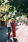 A couple dressed in coordinated outfits enjoying a sunny day.