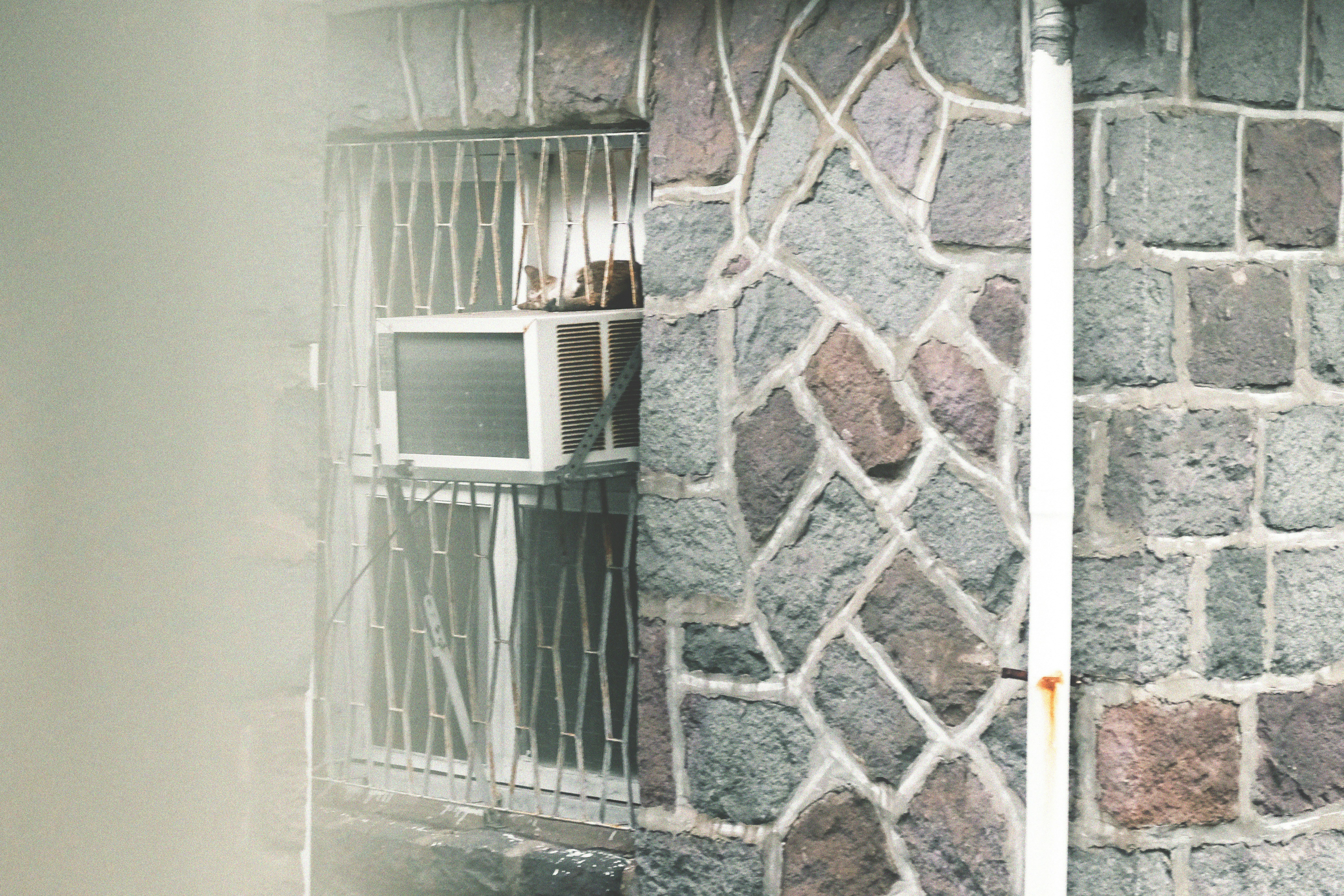 a brick wall with a broken window