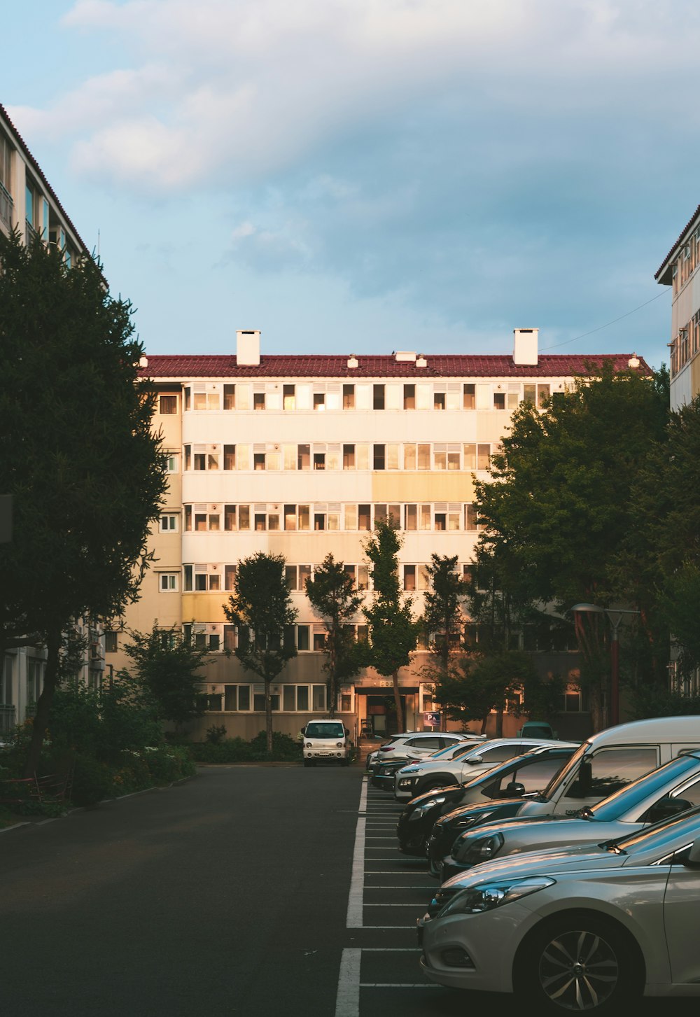 a building with cars parked in front