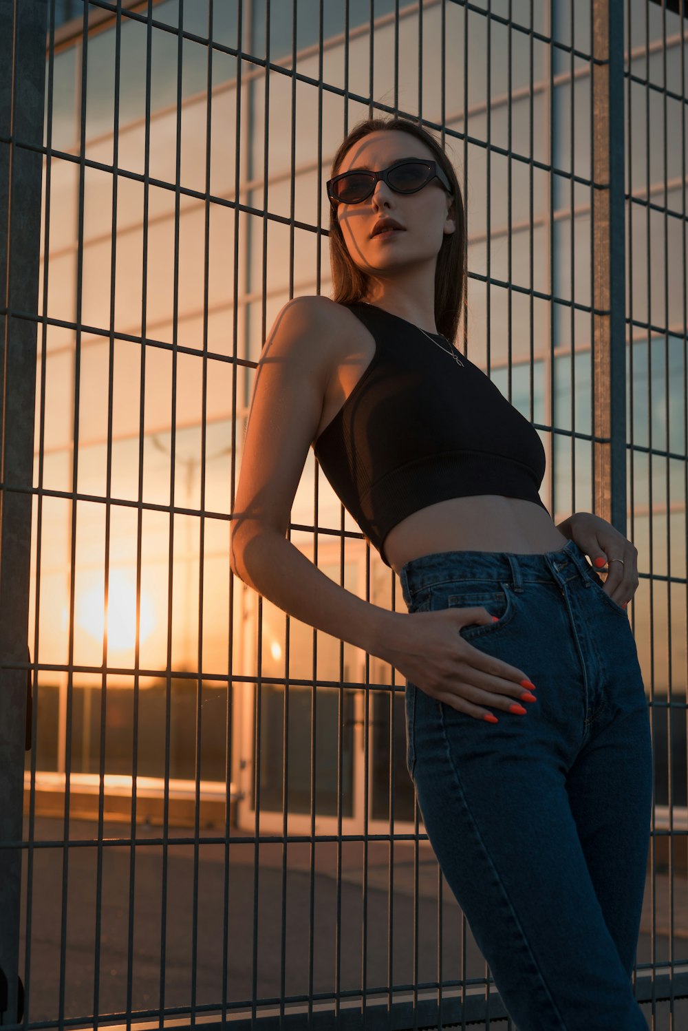 a woman standing in a cage