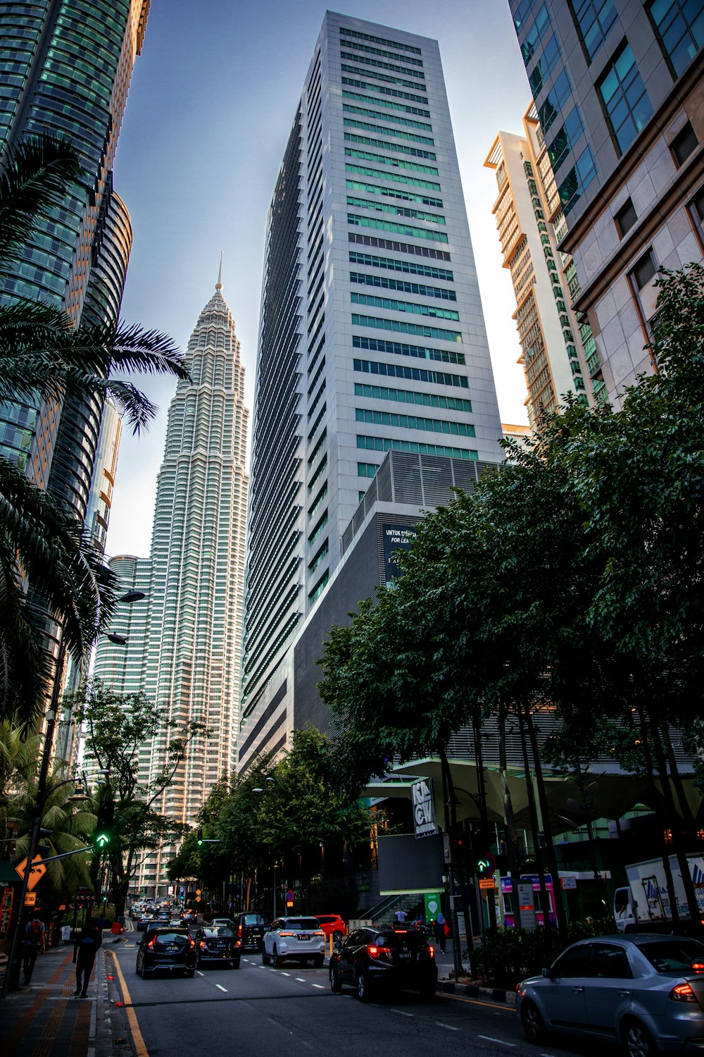 a street with cars and tall buildings