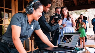 a person with headphones on using a laptop