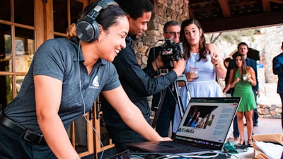 a person with headphones on using a laptop